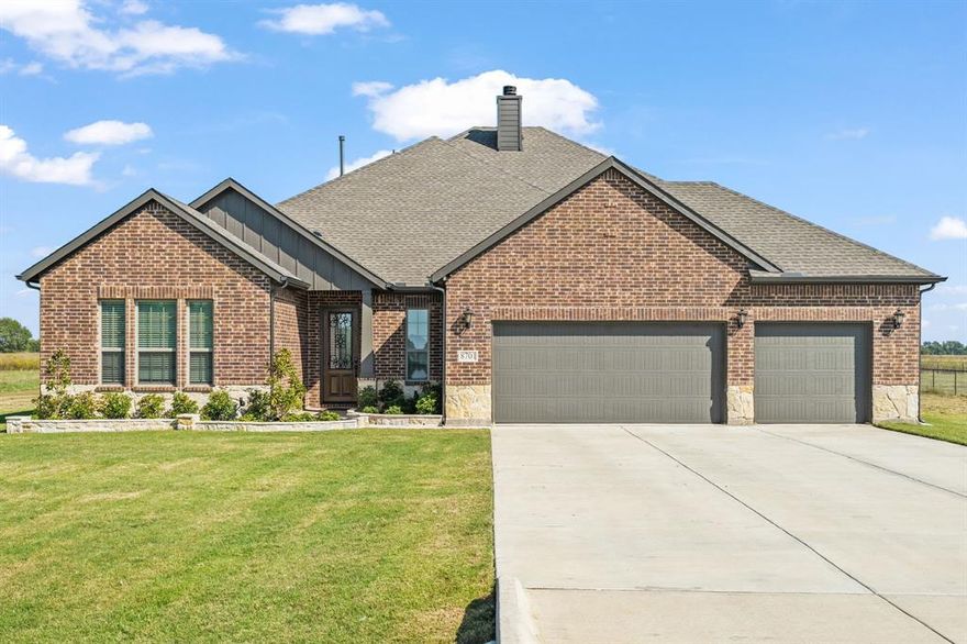 Feel Yourself Relaxing as you drive up to this Stone Hollow Beauty! Upgrades Outdo Anything Around!  So much space inside and out. OVER 1 ACRE LOT! Practically New! This one has it all!  Brand New Iron fencing coming soon!    4 Beds, 4 full Baths, Game Room or Flex Space up with another full bath up. Highly Rated Blue Ridge ISD!  Hardwood Floors in Entry, First Bedroom and Family Room. Dramatic stone fireplace, ceiling fans, designer lighting, open to chef's kitchen with a 6 ft by 10 ft island, double ovens, walk-in pantry, stone back-splash, gas cooktop and more!  Attached Dining Area is so much more usable than a closed off dining space.  Guests can mingle in the kitchen while they enjoy the country view or head out to the covered back patio to relax or grill out and watch the sunset sky be transformed into millions of stars!  You can really see them out here. Plenty of room for a pool and large storage building. 3 additional bedrooms down, one which is currently being used as an office. Primary Suite has high ceilings, ceiling fan, a panoramic bay window with views of a sprawling meadow where you might spot a deer or two, and room for a sitting area.  The Primary bath has Two Closets, every couples dream!!, with separate vanities and a make-up area, garden tub and walk-in shower with high end tile, a shower bench, private toilet room, and tons of storage.  The Game Room or Flex Space on the 2nd level has a full bath and plenty of room for a pool-table or you could use it as a 5th bedroom.  The Oversized, Extended 3 Car Garage is side-by side, big enough for your truck.  The Garage floor is professionally painted and sealed.  This home is all about lifestyle and getting away from the hustle and bustle of city life and living the country life you've been dreaming of.