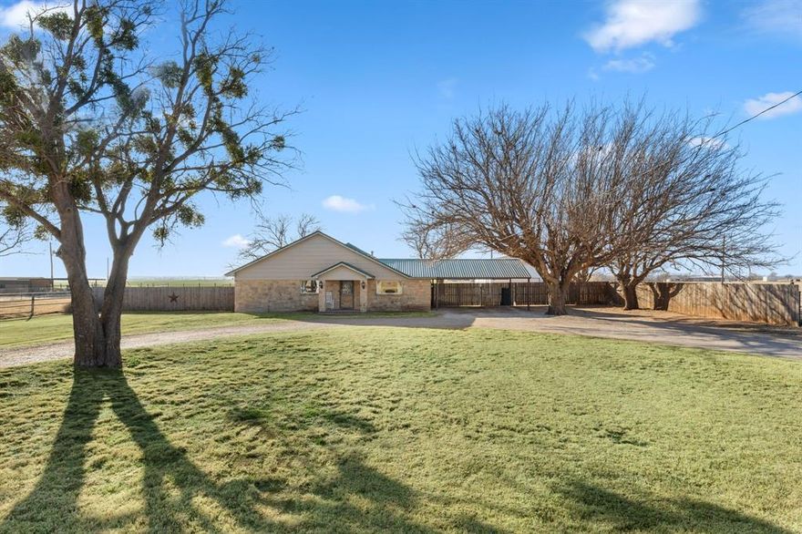 Rare opportunity on the edge of town! Situated on nearly one acre, this 4-bedroom home offers the perfect blend of space, functionality, and small town convenience, an increasingly hard to find combination in this area. The durable stone exterior and metal roof provide timeless curb appeal and low-maintenance living. Inside, you’ll find a well-designed layout with generous living spaces and an oversized laundry room offering ample storage and workspace. Step outside to enjoy the covered patio, ideal for relaxing or entertaining while overlooking the expansive yard. A standout feature is the detached 18x30 shop, perfect for hobbies, storage or work projects. The property also includes a private water well, adding both value and efficiency.
With room to spread out, practical upgrades, and a location that offers privacy without sacrificing proximity to town, this property is a unique find you won’t want to miss.