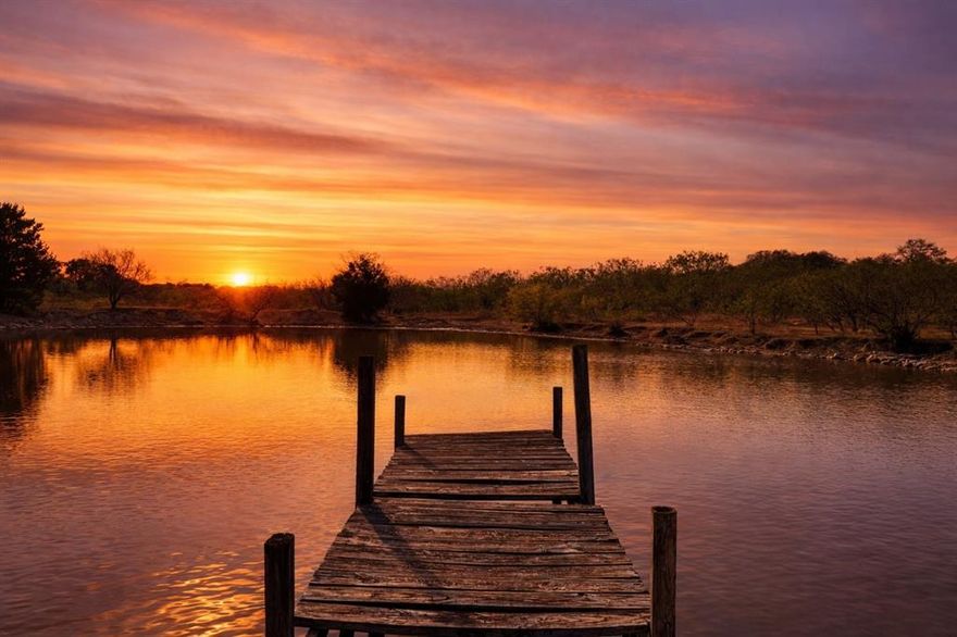 This 108.321 acre ranch sits just south of Hico and offers a great balance of grazing land, privacy, mature hardwoods, and recreational appeal. The property is fenced and hotwire cross-fenced, featuring three ponds and a wet-weather draw that feeds Honey Creek. Rolling terrain, live oaks, and wooded acreage provide excellent habitat for whitetail deer, turkey, and hogs. The land is ideal for ranching, hunting, and weekend enjoyment.

A 1,960 sq ft farmhouse built in 1994 offers 3 bedrooms, 2 baths, an office, and a wood-burning fireplace crafted from rocks salvaged from the original ranch house. A private water well supports the home along with a fenced orchard-garden-vineyard area and livestock trough at the working pens. Additional improvements include a large implement shed with carport space, ideal for storing equipment, vehicles, and ranch tools.

Located a few miles southeast of Hico, known for shops, dining, events, and small-town hospitality, and roughly 100 miles from Austin, DFW, and Abilene - this ranch offers strong usability, scenic building sites, and true Hill Country character.

All acreages and boundary lines shown on media are approximate. Certain images may have been digitally enhanced (e.g., sky, lighting) for marketing presentation. Any information provided herein is subject to changes, errors, omissions, prior sale, withdrawal of property from the market without prior notice, and approval of purchase by property owner.