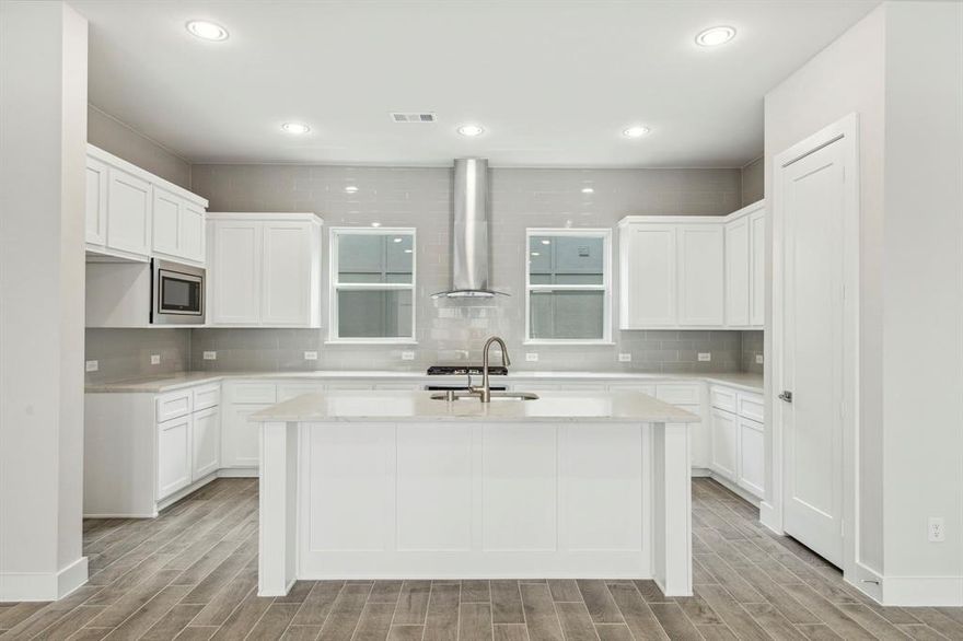 Tribeca Plan - SoHo Square offers exceptional amenities, including a resort-style pool, state-of-the-art fitness center, and a community center with a kitchen lounge, bowling alley, and game room featuring a pool table, golf simulator, and shuffleboard. Enjoy outdoor relaxation with two gas grills, a hot tub, and an outdoor TV, perfect for entertaining. Residents also enjoy easy access to Dallas' top shopping, dining, and events, as well as major highways for convenient travel around the DFW Metroplex. Megatel Homes' Tribeca plan is a four-story, 2,151 square foot home featuring three bedrooms, three and a half bathrooms, a covered balcony and a two-car garage.