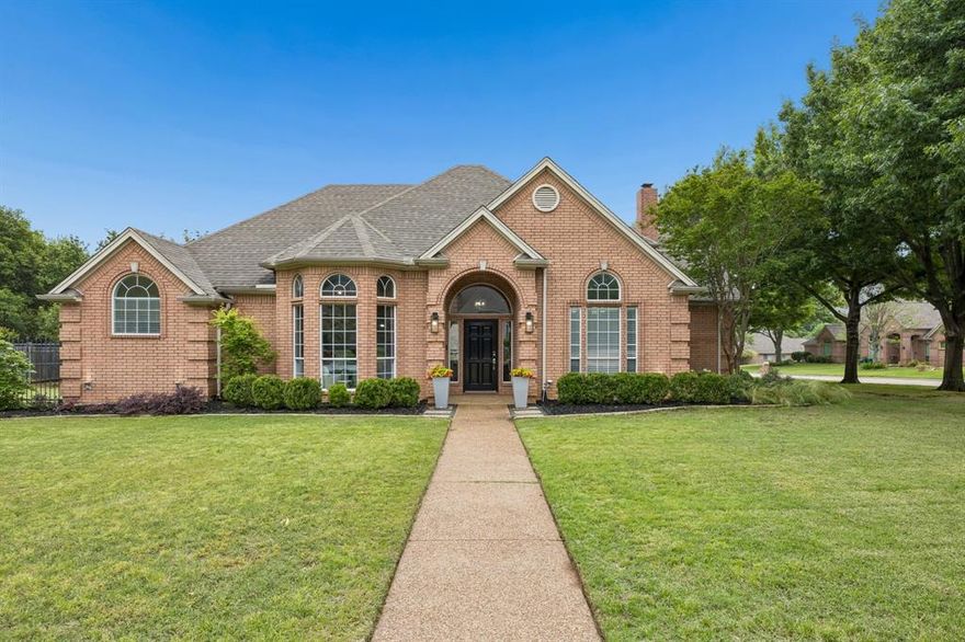 Located on a serene corner lot in Carroll ISD, 1309 Meadow Ridge Ct is a beautiful 4-Bedroom, 3-Bathroom 3 Car Garage home that perfectly blends modern upgrades with lasting charm. Every inch of this property has been thoughtfully reimagined, offering a move-in-ready haven with timeless finishes and functional elegance. Step inside to discover hardwood floors on the main level and new carpet upstairs (Fall 2025) The spacious first floor layout boasts 2 Bedrooms split, 2 living areas, private home office, separate dining and breakfast areas while the 2 Bedrooms up share a large Game Room and Jack-&-Jill bath. The freshly painted upstairs gives the home a bright, inviting feel. The heart of the home—the kitchen—has been completely transformed with sleek marble countertops, a matching backsplash, top-of-the-line appliances, and a custom wine area, perfect for entertaining. The dining room shines with classic wainscoting, while the living room boasts the warmth of recessed lighting. The bathrooms have been meticulously updated, with the Jack-&-Jill bath undergoing a full remodel and the downstairs bath featuring a stylish new shower, quartz counters, and updated fixtures. The primary bathroom is a spa-like retreat with marble floors, a luxurious shower and quartzite countertops. Custom storage solutions, incl back hall cubbies and an Elfa designed closet upstairs, ensure every detail is as practical as it is beautiful. Outside is your personal oasis, starting w the covered patio, a fully equipped outdoor kitchen w a heater, sparkling pool & spa alongside a firepit and lush landscaping all designed for year-round enjoyment. The backyard is the perfect spot to host gatherings or unwind in complete privacy. Additional highlights incl a custom dry bar w a fridge, new lighting throughout & significant updates to enhance both style & functionality. Don’t miss the chance to call this meticulously upgraded & thoughtfully designed home your own. Schedule your private tour today!