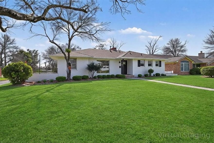 Welcome to this beautifully remodeled ranch style home in the established Highland Oaks community of Dallas. Situated on an oversized 0.313 acre lot with mature trees, this 3 bedroom, 2 bathroom residence offers 1,821 square feet of updated living space designed for comfort and functionality. The home has been fully repainted and features new flooring throughout, creating a fresh and modern feel from the moment you walk in. The spacious living room with fireplace flows seamlessly into a second family room, providing an ideal layout for entertaining or everyday living. The completely updated kitchen showcases new countertops and cabinets along with ample space for cooking and gathering, plus an eat in area and separate dining room for added flexibility. The private primary suite offers a custom closet system and an ensuite bath with built in cabinetry and a relaxing garden tub. Two additional bedrooms with ceiling fans share a well appointed full bath. Enjoy outdoor living on the covered front porch or patio overlooking the large backyard with plenty of room to create your own outdoor retreat. Additional highlights include updated windows, a two car attached garage, central heating and air, natural gas, and no HOA. Conveniently located in Dallas ISD near parks, shopping, dining, and major highways, this move in ready home blends modern updates with classic charm. Call the listing agent today for more details and to schedule your private showing!