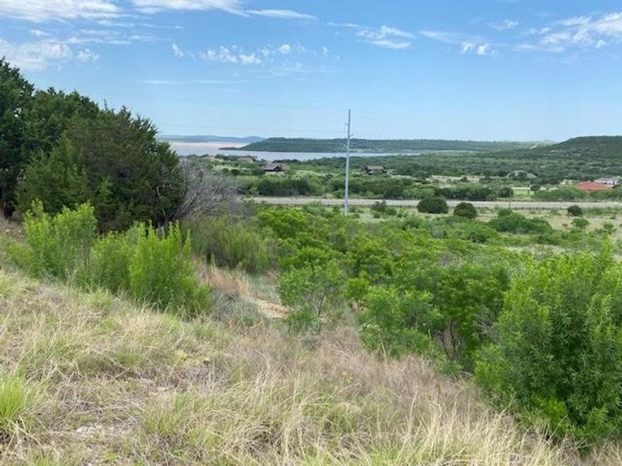 This two acre lot overlooks Possum Kingdom Lake's north end. Property slopes away from the roadway. Lot ownership permits the use of all cummunity amenities including; boat storage, boat ramp, community dock, Ritchey Cabin and picnic area, clubhouse with pool and fitness center, fishing pond, walking trail, twenty miles of private roadway behind the gates.