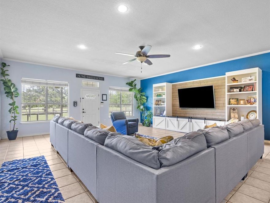 Welcome to 205 Private Road 2194 — a spacious 4 bed, 3.5 bath home on 4 acres, tucked into treed surroundings with easy access to Hwy?287 and Hwy?380. With 3,180 sq ft of living space and a thoughtful layout, this property offers comfort, flexibility, and room to grow.

At the heart of the home is a chef-worthy kitchen—featuring professional-series stainless appliances, granite countertops, natural wood cabinetry, gas cooktop, a massive island with bar seating, and abundant storage throughout. The open flow into the living and dining areas makes it easy to entertain or keep the conversation going during weeknight dinners.

Just off the kitchen, a sunroom-style office wrapped in windows overlooks the peaceful, tree-lined backyard—perfect for work, hobbies, or a quiet morning coffee. The oversized laundry and mudroom is tucked away with room to organize daily life with ease.

The primary suite is tucked away for privacy and relaxation, featuring a spacious layout, soaking tub, walk-in shower, and dual vanities. The three additional bedrooms are designed with family in mind—two share a connected Jack-and-Jill bath, while the third a private full bath. A separate half bath near the main living areas adds everyday convenience for a busy household.

Outside, the 40x50 metal shop includes a 40x30 enclosed slab and a 40x20 covered extension—ideal for parking, storage, or your next big project. Whether you’re planning weekend builds, storing equipment, or creating a home business hub, this space is ready for it. The home runs on a private water well with a whole-house reverse osmosis system and a 1,000-gallon storage tank that delivers clean, reliable water year-round. Outdoors, there’s room to garden, play, or simply enjoy the view under the wide Texas sky.

Plenty of space, thoughtful updates, and flexible living—ready to fit your lifestyle today and in the years to come.

Buyer to verify all information.