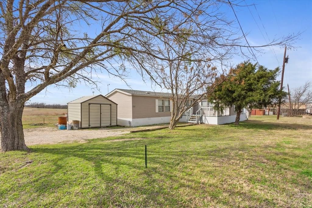 Photo of 216 Moore Street, Rogers, TX 76569 (MLS # 21194243)