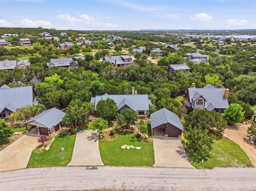 Discover refined lake living in this beautifully designed single-story cabin located within the prestigious Harbor community. This 4-bedroom, 4-bath home blends timeless rustic character with a thoughtfully designed open-concept layout, creating an inviting space ideal for both relaxing and entertaining.

Offered fully furnished, the property is truly turnkey and ready for immediate enjoyment. The private, fenced yard provides a peaceful outdoor setting with plenty of room to unwind or host guests.

A detached garage and additional carport offer versatility for parking, storage, or gathering space. Ownership in the Harbor includes access to an exceptional collection of upscale amenities, including a resort-style pool, fitness center, sports courts, putting green, playground, walking trails, marina access, and on-site dining.

A rare opportunity to own a move-in-ready retreat that delivers comfort, privacy, and elevated lake living.
