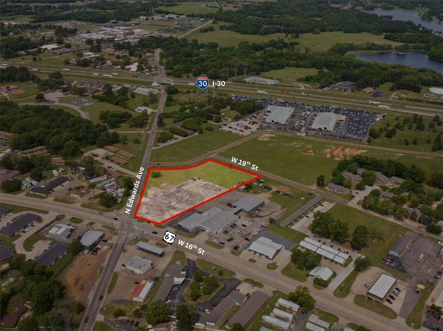 Prime 3.7 acre commercial lot featuring road frontage on three sides, offering excellent accessibility and visibility. Conveniently located near I-30 in a high-traffic area, this property is ideal for a variety of commercial uses. Owner is also open to long term lease opportunities.