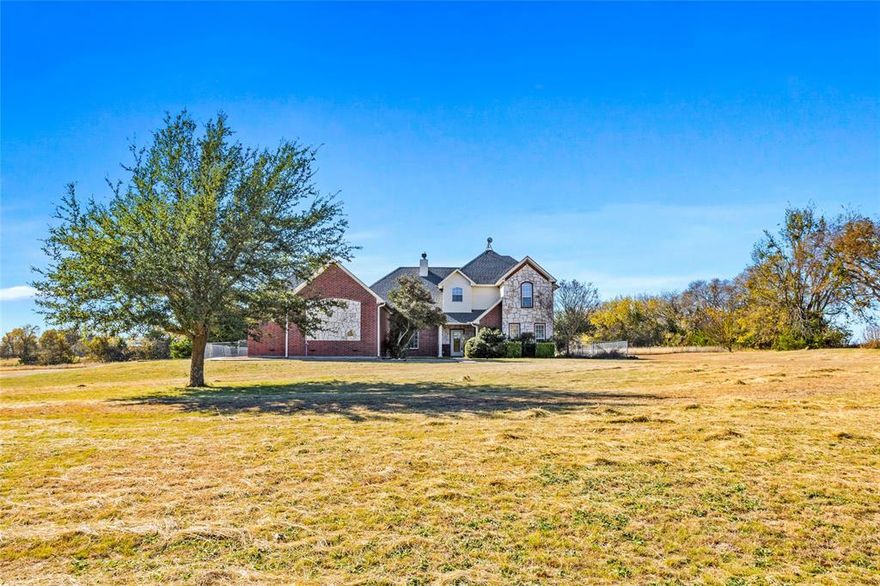 Follow the beautiful tree-lined lane to this one-of-a-kind spacious home on 10 acres, truly a secluded country estate close to Van Alstyne within the Van Alstyne school district. Bring your horses! Backyard includes patio, extra-large gazebo and outdoor pool, all perfect for entertaining and making lasting family memories! Also, a separate 40x50 outbuilding, a workshop with drive-through access. Perfect for RV and boat storage, additional cars, etc. You'll enjoy the spacious feeling in each room with high ceilings, neutral decor and an interesting floor plan! Two bedrooms up and two on the main floor. Office with beautiful palladium window overlooking front yard. Primary bedroom has walk out to the pool area and beautiful ensuite bath. Game room upstairs has a game closet with french doors.  laundry room is ultra-spacious with beautiful built-in cabinetry, corner sink and lots of extra room! Ceilings fans throughout and lots of storage. This home has an abundance of natural light through windows overlooking the private 10 acres. This home offers endless possibilities for you to make it your own. You're going to love it!