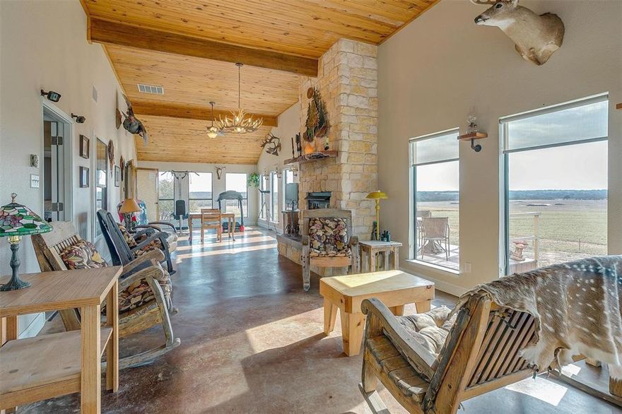 Truly a dream property! Magnificent home sits on a hill overlooking 305 beautiful acres. Home boasts custom granite countertops and custom pecan wood cabinets throughout. Kitchen with farm sink and island opens up to the living room which features a wood burning stove. From there step into the wonderful front room running the entire length of the house giving you fantastic views out the bay windows while warming yourself by the wood burning fireplace. Primary walk in closet has a gun safe room with metal plating under the sheetrock. Man cave with vaulted ceilings contains a Family Safe tornado shelter. Oversized detached garage has work space and a 50 amp plug; open covered area behind garage for outdoor cooking with small storage and meat processing room. 25x22 carport. Property is completely high fenced and cross fenced with approximately 40 Fallow Deer and 17 Red Deer. This can be a perfect turnkey getaway located about 90 minutes from DFW! Additional information available.