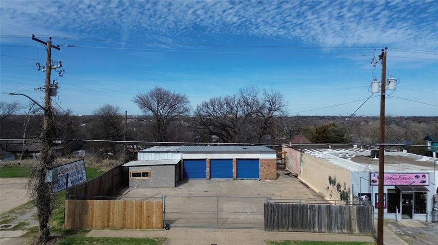 Prime commercial opportunity located just minutes from the historic Fort Worth Stockyards in the rapidly growing Northside corridor of Fort Worth. Zoned FR, General Commercial Restricted, this property offers flexible use options including retail, office, automotive related services, contractor operations, light service businesses, and more. Buyer to verify specific use with the City of Fort Worth. The site features a multi bay warehouse shop layout with three grade level roll up doors, providing excellent functionality for owner users or tenants. A fully fenced and gated lot offers secure yard space ideal for fleet parking, equipment storage, or outdoor work area an increasingly rare feature in this submarket. The property also includes a front retail or office component with street visibility, creating the opportunity for customer facing operations or potential multi tenant configuration. Surrounded by residential density and ongoing redevelopment, the location benefits from strong traffic flow, proximity to major thoroughfares, and continued growth driven by tourism and commercial activity near the Stockyards. This is an excellent opportunity for an investor seeking value add potential or an owner operator looking to establish or expand in one of Fort Worth’s most active commercial districts.