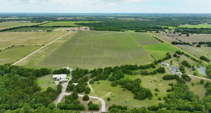 THE BEST OF BOTH WORLDS. COUNTRY QUIET AND CITY CLOSE.  Rare opportunity own 59.6 beautiful acres in Grayson County but within driving distance to Dallas Metroplex shopping, restaurants  and entertainment. Nestled conveniently at the back-end of Van Alstyne TX Anna TX and Melissa TX near the CollinGrayson County line.  Build your own private estate your private walking trail or riding trail. Park-like settings. Boutique wineries located nearby with this land having potential for one. Pictures tell the story for privacy.  Property in an exclusive neighborhood with all neighbors having acreage. 10-acre subdividing allowed maintaining neighborhood restrictions without the weight of a potential subdivision takeover. Outside the city limits and in the ETJ with no restriction to build. No city taxes. Ag EXEMPT plus Grayson County has one of the lowest property tax rates. And with acreage pricing on the rise for this area investors seeking a buy and hold strategy this property is ideal for future 10 acre lots for luxury living.  Endless possibilities. COUNTRY quiet yet City CLOSE BY.