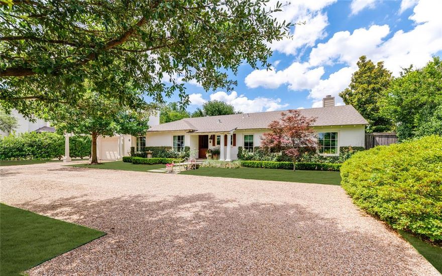 Tucked away in the heart of Preston Hollow, this enchanting country home offers a rare blend of timeless charm and natural beauty. Surrounded by mature landscaping, the property feels like a secluded retreat, where ivy-covered walls, winding garden paths, and blooming roses create an atmosphere of quiet romance and refined elegance. Every corner of the home seems to engage with its lush surroundings—sunlight filters through canopy trees, and fragrant blooms frame peaceful views from every window. With its storybook ambiance and the intimate feel of an English cottage, this home is a private haven that invites you to slow down, breathe deeply, and savor the beauty of nature all around.
The home features 4 spacious bedrooms, bright formal living and dining spaces including a secluded primary retreat that offers a true escape. This luxurious primary suite boasts dual walk-in closets, a jetted soaking in its spa-inspired ensuite. Every inch of this residence speaks to elevated living and timeless style—crafted not just as a house, but as a designer’s personal expression of home.