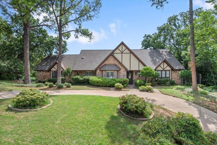 Art meets architecture in this one-of-a-kind custom home in The Oaks of Arlington. Nestled on a rolling lot shaded by native trees, this stunning property offers panoramic views of the neighborhood and unforgettable character inside and out. Thoughtfully designed and meticulously maintained by its original owner, the home features two striking glass-walled office spaces overlooking the private pool, making it ideal for creatives or remote professionals.

A pool house offers protection for the sparkling pool, while the interior boasts bold design elements and spaces that challenge the ordinary. With soaring ceilings, artistic angles, and abundant natural light, every room feels inspiring. This is not your cookie-cutter home—it’s a true original that must be seen to be believed.  All information deemed reliable but not guaranteed; buyer to verify.