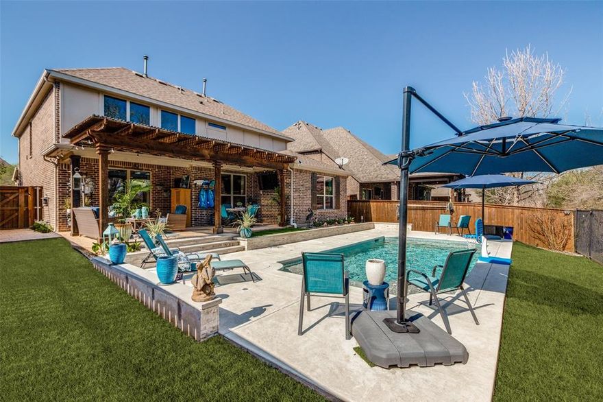 Stunning 2-Story Dream Home on a Greenbelt with Pool & Expansive Outdoor Living! This absolutely gorgeous home backs to a peaceful, tree-lined greenbelt & features a sparkling in-ground pool and an incredible covered outdoor living space—perfect for relaxing or entertaining. Step inside to find beautiful engineered wood floors throughout most of the main level and a welcoming private study near the front of the home overlooking the charming covered porch. The spacious family room features soaring vaulted ceilings, creating an open, bright atmosphere filled with natural light. The chef-inspired kitchen offers abundant cabinet storage, granite countertops, subway tile backsplash, gas range, and a large walk-in pantry. The laundry room includes several thoughtful upgrades and added functionality. The primary suite is a true retreat, overlooking the scenic greenbelt and pool area. The luxurious ensuite bath features a spacious walk-in shower, extensive cabinetry, dual vanity space, and a large walk-in closet. Upstairs you’ll find a versatile loft area plus a separate enclosed bonus room ideal for a media room, game room, or flex space. Two generously sized secondary bedrooms provide plenty of room for family or guests. Step outside to an exceptional covered outdoor living area with abundant space for entertaining. The backyard pool is the perfect size for fun and relaxation, and the seller includes a convenient winter pool cover. The treed greenbelt behind the home creates a private, serene setting. Located in the highly sought-after Trinity Falls community featuring 450 acres of natural beauty and resort-style amenities including:  Two community pools with clubhouses, Fitness center, Dog park, Fishing lakes (catch & release), Playgrounds, Disc golf course, Extensive biking and walking trails. The award-winning Frazier Elementary School is conveniently located just a couple of blocks away. This home truly has it all—style, space, location, and incredible outdoor living!