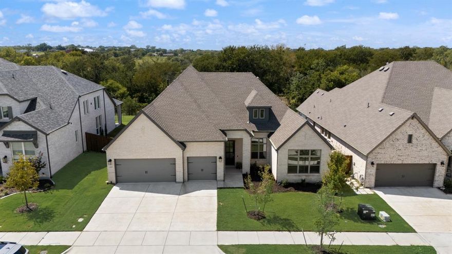 Welcome to this beautifully designed single-story home backing to a lush greenbelt and community walking trail. Thoughtfully crafted with modern style and functional living, this home offers 4 spacious bedrooms, 3 full baths, and a dedicated office with french doors for added office privacy.  The open-concept kitchen, living, and dining areas showcase peaceful views of the backyard, with walls of windows dressed in custom shades for both light and privacy. The kitchen features a prep center island, gas cooktop, a huge walk-in pantry and abundant cabinetry, opening into the family room for effortless entertaining. The split-bedroom layout ensures privacy, while the luxurious primary suite includes a spa-like bath with dual vanities, soaking tub, lovely shower, separate linen and walk-in closet. Additional highlights include tile wood look flooring throughout the main living spaces, decorative lighting, a spacious laundry room with folding table, a foot locker, and a 3 car garage. Step outside to a private backyard with covered patio and endless greenbelt views. Residents enjoy access to a resort-style pool with cabanas, playground, sports courts, and scenic walking trails.