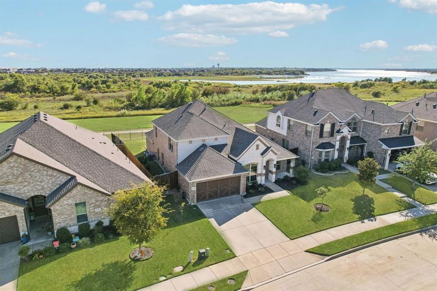 Views, views, views! Gorgeous north facing lake view home with rare 5 bedrooms and 3.5 baths. Sweeping views from this open floor plan home are breathtaking, but take the time to enjoy all the home has to offer too! Kitchen has luxury designer upgrades, butlers pantry, fabulous island, double ovens, quartz countertops, built in sub zero-style fridge and freezer. Custom built in cabinets in laundry room. Oversized primary suite feels like a luxury retreat with custom sound-insulated walls, lake views, sitting area and double showers. The large backyard with extended patio takes advantage of sunrises, sunsets, and a spectacular 4th of July show over the lake view! Upstairs features private suite, bed, bath, and 2nd living space. Oversized garage with epoxy flooring. Built out attic space for storage. All of this in a very desirable community SOUTH of 380, with resort style pool, fitness center, parks and scenic trails. Close to restaurants, shopping, HEB, Costco and PGA.