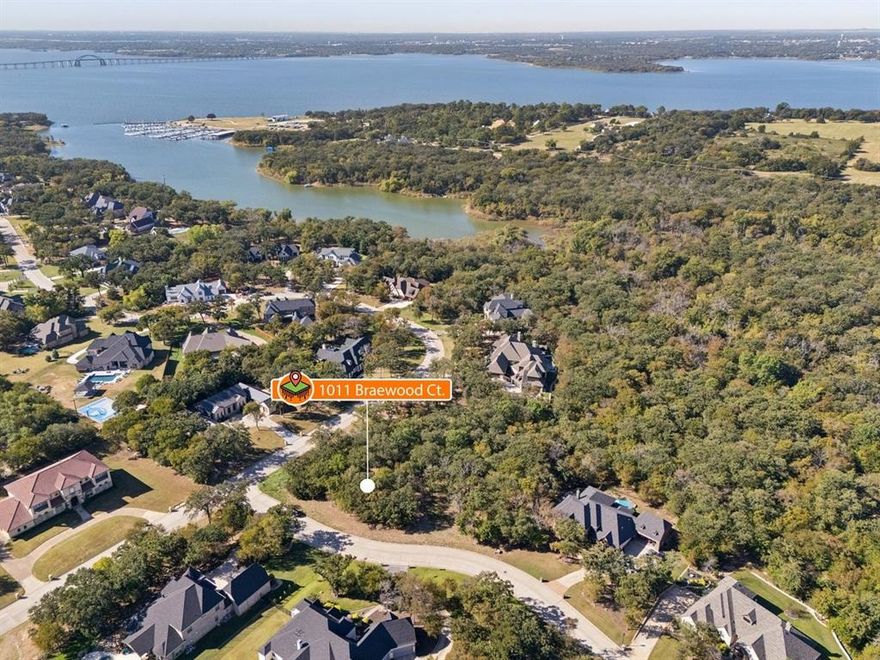 Build your dream home on this beautiful wooded lot located in a private, gated community with lake access. Enjoy the peace and privacy of mature trees while being just moments from the water. This property offers the perfect setting for your custom home in a serene, sought-after neighborhood.