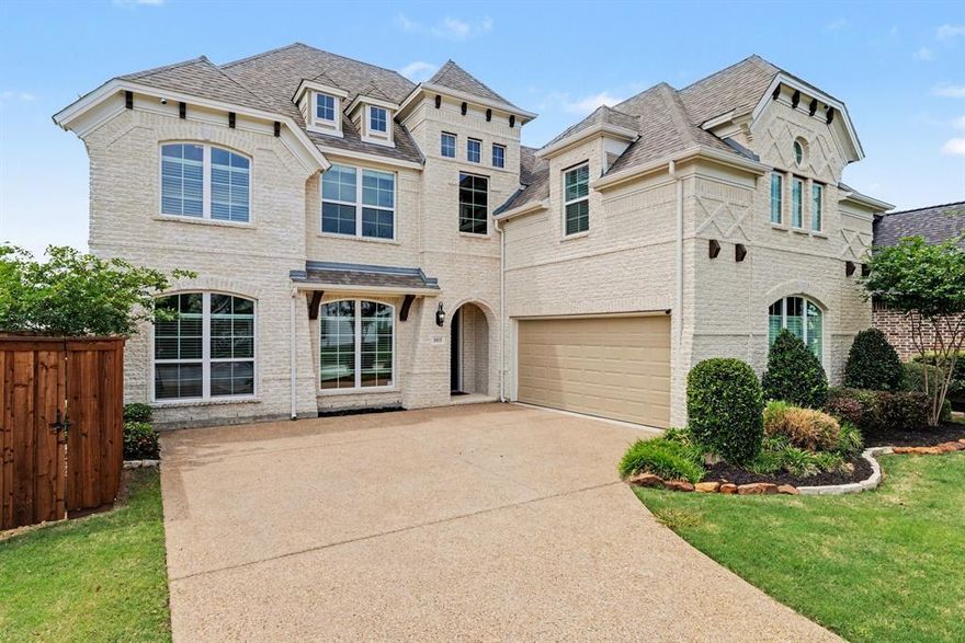 SELLERS OFFERING $5K BUYER CONCESSION TO REPLACE THE CARPET. Stunning, one-owner residence by Grand Homes the HARTFORD PLAN WITH TWO PRIMARY MASTER SUITES is ideally positioned in the highly sought-after Wilmeth Ridge. From the moment you arrive, the home captivates with its striking curb appeal, highlighted by a swing-style two-car garage and refined architectural presence. Step inside to an impeccably maintained interior where elegance unfolds at every turn. The grand entry is flanked by a sophisticated living area, while double doors reveal a private executive study. A formal dining room with charming bay windows sets the stage for memorable gatherings. At the heart of the home, the chef’s kitchen impresses with a large center island, gas cooktop, abundant cabinetry, and a new high-end Whirlpool dishwasher, all flowing seamlessly into the sunlit breakfast nook and expansive living room. A wall of windows floods the space w-natural light, beautifully complementing the cast stone fireplace creating an inviting atmosphere. Privately situated at the rear of the home, the luxurious primary suite offers a serene retreat, complete w-space for a sitting area & a spa-inspired bath. Designed with both comfort & flexibility in mind, the thoughtfully crafted floor plan includes a split first-floor guest suite, while upstairs boasts a second primary suite, along w-two additional bedrooms. A dramatic staircase leads to an entertainer’s dream, an expansive game and media room combination perfect for hosting or relaxing. This home is further enhanced by over $24K in premium upgrades, including a climate-controlled garage with mini-split AC & heater (remote operated), custom garage storage + high-end window treatments throughout, including the garage. For added convenience & future-forward living, the home is equipped wpdual Level 2 EV chargers (WiFi-enabled), compatible w-both Tesla & CCS J1772 vehicles. Outdoors, enjoy a peaceful backyard setting that backs to lush greenspace.