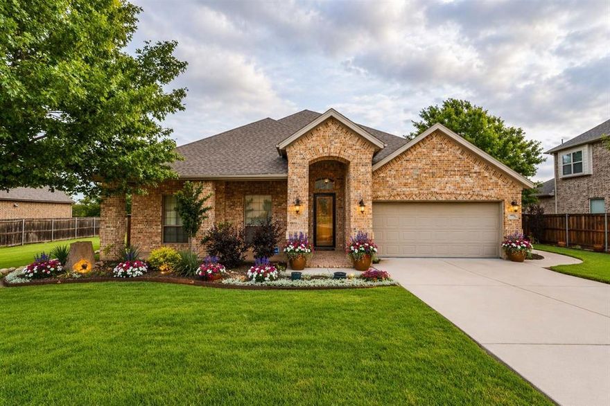 One-owner one story 4-bedroom, 2-bath home on a larger lot with no backyard neighbors. This home boasts beautiful hardwood floors, an open-concept layout, and well-maintained landscaping.  Features a mudroom just inside the home from the 2 car garage. Tile flooring throughout entry and kitchen with wood like lvp in living and primary.  Primary is large with sitting area, french doors leading to back patio and separate shower with garden tub. Nestled in Marine Creek Ranch. This HOA offers private lake access with boating, swimming, and beautiful downtown Fort Worth views. Enjoy a year-round pool, clubhouse, trails, private dock, fire pits, playground, and community garden—all in one unique, outdoor-focused community.