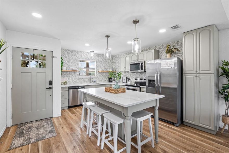 Step into lake life with this stylishly updated getaway on the Fort Worth side of Granbury, just a few houses from the mainbody water! Currently a thriving short-term rental with steady bookings, this turn-key property comes fully furnished—everything you need to start enjoying or earning from day one. Renovated in 2023, it boasts a fresh HVAC system, new appliances, sparkling quartz countertops, luxury vinyl wood flooring, updated light fixtures, and completely refreshed bathrooms. Outside, unwind by the fire pit under the stars, then hop into the hot tub for the perfect end to your day. Recent upgrades include new boat slip decking, retaining wall, and iron fencing. Whether you’re looking for your own weekend escape or a proven income-producing investment, this lake house delivers the ultimate blend of comfort, style, and location.  New roof and gutters in July 2025. All furnishings, fire pit, and hot tub convey with the property. Scheduling for viewings must be made in advance to keep with rental bookings.