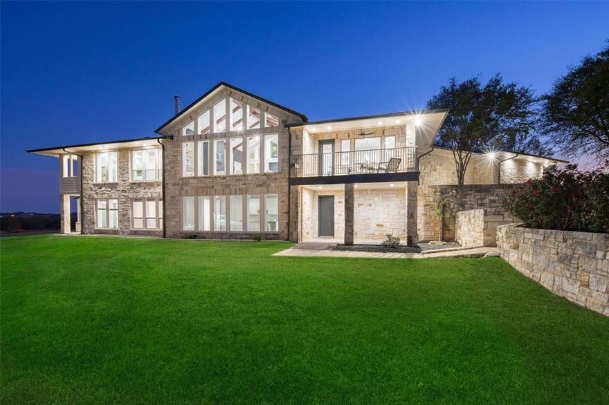 Experience luxury at this 20-acre hill country modern estate, just 30 minutes from Dallas and 40 minutes from Fort Worth. The entrance showcases a cathedral ceiling with wood beams and vast windows framing rolling countryside. The chef's kitchen is a design masterpiece with custom cabinetry and a private balcony boasting idyllic views. A wine cave invites intimate tastings, and the office suite goes beyond, featuring an additional lounge and a secure vault room, a sanctuary for creativity. The primary suite is an elegant symphony with a private balcony and a massive custom closet. Explore the bottom floor's in-law suite, two bedrooms, a greenroom, and a playroom with a stage. Sustainability shines through in the construction with 12-inch thick walls, a spray-foamed attic, and a solar hot water heater, earning ENERGY STAR designation. The property includes a 1800 sf barn. More than a residence, it's a lifestyle! Adjacent 20 acre property is also available that includes stocked pond.