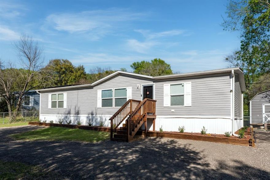 Charming 3-bedroom, 2-bath home located in the highly desirable Tamarack community! This property offers both comfort and functionality, starting with a fully fenced backyard—perfect for pets, play, or relaxing outdoors. A convenient circular driveway, along with additional side parking, provides ample space for vehicles, boats, or recreational toys. The property also features a large powered storage building complete with multiple outlets and lighting—ideal for a workshop, hobby space, or extra storage. Inside, you’ll find a bright open floor plan designed for easy living. The spacious primary suite includes a private ensuite bath and generous walk-in closet space. The kitchen is both stylish and practical, featuring durable laminate-style countertops, modern appliances, low-maintenance vinyl flooring, and an expansive prep area perfect for cooking and entertaining. Energy efficiency is a major bonus with 26 state-of-the-art solar panels already installed. Residents of Tamarack enjoy access to fantastic community amenities, including a swimming pool, fishing pier, playground, and boat ramp—offering something for everyone to enjoy. This home truly combines comfort, convenience, and lifestyle—don’t miss your opportunity to make it yours!