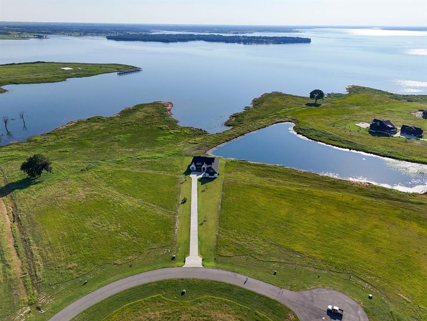 The Only Lakefront Home Currently Available on Bois d’Arc Lake! Experience luxury lakefront living in this stunning 5-bedroom, 4.5-bathroom, 3,247 sq. ft. residence located in The Peninsula at Bois d’Arc Lake—one of the most sought-after communities on North Texas’s newest lake. Built as a second home and meticulously maintained by the original owners, this property offers a rare blend of elegance, comfort, and functionality. Situated on a premium 1+ acre waterfront lot(with 56 piers under slab), the home boasts panoramic lake views, exceptional privacy, and direct access to all that lake living has to offer. Spacious open concept living designed for entertaining and equipped with the Sonos Sound System. Oversized garage with ample room for lake toys and vehicles.  The dock-capable lot has dock engineering plans drawn and an application filed with the NTMWD which has been preliminarily approved, awaiting their final approval. The perfect full-time residence, weekend retreat, or investment opportunity, this is a rare chance to own a waterfront estate on the brand-new Bois d’Arc Lake!