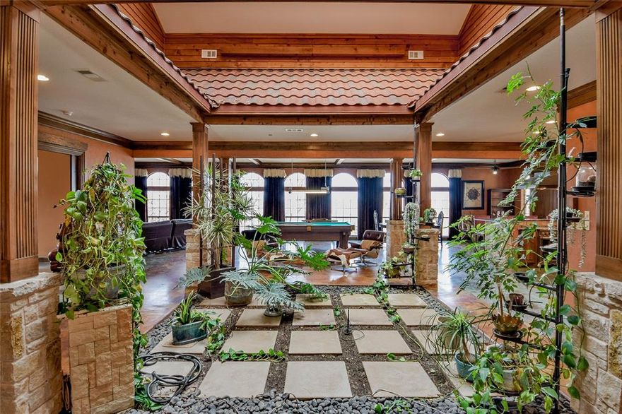 NEW CLASS 4 ROOF Situated on 4 Originally Platted Lots
Escape to your own private villa retreat, nestled across four expansive lots with sweeping views of Granbury and peekaboo lake views. This one-of-a-kind property offers exceptional privacy, character, and seamless indoor-outdoor living.
The main level features three bedrooms and two baths, while the upper level provides additional finished space complete with a bathroom and three versatile rooms—ideal for guests, a home office, fitness studio, or creative retreat.
At the heart of the home is a stunning central atrium, thoughtfully designed to bring in natural light and create a tranquil, open atmosphere. Each bedroom features solid wood pocket doors that open directly to this serene courtyard, enhancing the home’s unique architectural charm.
The spacious primary suite is a true sanctuary, offering direct atrium access and an ensuite bath with a walk-in shower, bidet, and an oversized closet.
The chef’s kitchen is designed to impress, featuring a 48-inch Italian gas range with griddle and induction cooking, built-in refrigerator, steam oven, and wine cooler—perfect for entertaining at any scale.
Step outside to enjoy multiple patios and outdoor living areas, a fire pit, and a private setting that makes this property feel like a destination.
A rare opportunity to own a distinctive traditional home with villa-inspired design, expansive space, and captivating views.