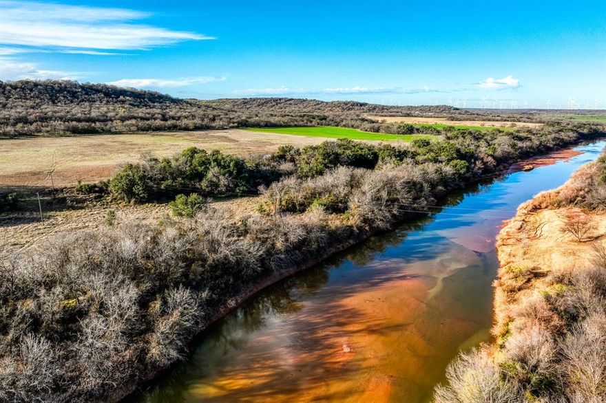 Nestled in the history filled Brazos River region sits the Macleod Ranch.  This 200-acre ranch boasts over ¼ mile of Brazos River frontage.  The topography varies and close to the river is a high point with views the Indians used to use to monitor nearby Ft. Belknap located several miles away.  Indian artifacts abound on this ranch for the history enthusiasts.  A perfect piece of property for a weekend getaway, a hunting camp, or to build a dream home, this ranch is an open palate waiting for one’s desires. The cover ranges from heavy to open down near the river, and the trees are primarily live oak, oak, and mesquite.  The ranch is also perfect for grazing cattle. As this part of Young County is known for excellent white-tail hunting, this ranch does not disappoint.  In addition to the deer, turkeys, hogs, doves, ducks and other varmints abound. Fences are in good shape and the ranch is cross fenced.  There are 2 tanks in addition to the river, so water is not a problem for the wildlife or cattle. Located 20 minutes from Graham, and 2 hours from Ft. Worth, this ranch is the perfect choice for its location.  If 200 acres isn’t enough, a neighbor ranch consisting of 630 acres is also for sale and combining the two would allow for a large 800 plus acre contiguous ranch that would complement each other, both with river frontage on the Brazos.