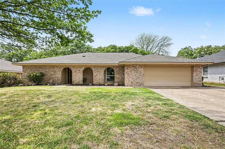 Welcome to this charming ranch-style home in the highly desirable Wintergreen Acres neighborhood of Hurst! This inviting 3-bed, 2-bath residence offers approx. 1,808 sq. ft. of comfortable living space, a spacious floor plan and great natural light. Enjoy a large, heavily treed lot with plenty of backyard space — perfect for outdoor entertaining or relaxing under mature shade trees. Recent updates include a newer roof, updated windows and a modern AC system. Located in the award-winning Birdville ISD and just minutes from shopping, dining and parks — this home blends convenience with peaceful neighborhood appeal.