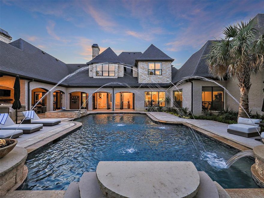 Welcome to this stunning updated home in gated Terra Bella, zoned to Carroll ISD & Westlake Academy! On almost 1 acre with stunning curb appeal, this home greets with a soaring Entry, Executive Study & Formal Dining room. Updated Bar & Wine rooms lead to the Great room with a modern vibe & gorgeous backyard views! The spacious Family room has a warm fireplace + floating shelves. The Chef's Kitchen has commercial Thermador appliances, honed marble counters, hand-made backsplash tiles & tons of storage. 1st Floor Game Room + Media room are ready for everyone to enjoy! Enter The luxurious Master with perfect backyard views, spa-like bath w floating tub, dual vanities + generous walk-in closet. Private Guest Suite + Exercise are down. Upstairs are 3 private Beds w updated baths & large closets, Bonus Game room & Craft room. Step outside to the backyard oasis with sparkling pool w laminar jets, fire bowls, tanning ledge, covered living areas, outdoor kitchen, tons of grass + gorgeous trees.