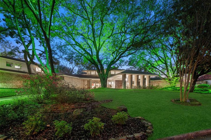 Welcome to the ultra private Inwood Estates cul-de-sac in the heart of Old Preston Hollow. As you approach this expansive, elevated property, a dramatic sweeping circular drive and mature landscaping with towering lighted trees lead to an impressive grand porte-cochère with striking mid-century architecture.

A unique wood double-door entry opens to a breathtaking soaring foyer with marble floors, setting the tone for this extraordinary residence. The elegant, symmetrical floor plan offers gracious transitions around a sensational 20-foot marble fireplace into a magnificent entertaining area with windows framing spectacular pool views.

Designed for both refined gatherings and relaxed living, the living room features a wet bar, generous sitting areas, a piano space, and a game table area. One wing opens seamlessly into a formal dining room overlooking the pool and gardens.

The oversized kitchen is complemented by a sunlit morning room, large pantry, and separate silver closet. Accommodations include a private guest suite and a versatile room with full bath opening to a secluded courtyard, ideal as a library or study.

A fully independent two-bedroom guest apartment offers a living room, kitchen, and bath, perfect for extended stays or multigenerational living. The three-car garage is complete with a full bathroom.

A distinctive octagon-shaped vestibule connects the bedroom wing and serene primary suite. Two spacious ensuite bedrooms enjoy courtyard views, while the primary offers pool views, a large bath with sunken tub, and dual bath layout with separate closets.

The backyard showcases a covered patio overlooking the pool, plus a 625 sq ft guest or studio suite with full bath and private patios. Lush gardens, mature trees, and winding walkways create exceptional privacy.

Set on a one-acre lot, this home was originally built by renowned architect Hal Anderson, and has been meticulously maintained and thoughtfully updated.
