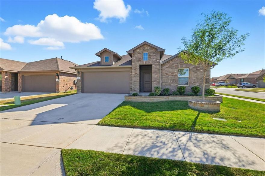 Immaculate Single-Story 4-bedroom Justin floor plan perfectly situated on a desirable corner lot! Loaded with more upgrades than a new construction home! This immaculate home offers a modern open-concept layout, ideal for entertaining, with the living and dining areas seamlessly flowing together. At the heart of the home, the chef’s kitchen features a large island, granite countertops, stainless steel appliances, gas range, and a spacious walk-in pantry—perfect for gatherings and everyday living. The primary suite is a private retreat with a double-sink vanity, oversized 5-foot shower, linen storage, and a generous walk-in closet. Generous size secondary bedrooms. Additional highlights include beautiful tile flooring, smart home technology, increased insulation in attic, glass shower doors, gutter leaf filter system and energy-efficient solar panels to help reduce utility costs. Step outside to enjoy a covered patio overlooking the good size backyard, ideal for relaxing or entertaining outdoors. Community amenities include a pool, playground, and scenic walking trails. Short distance to the Fort Worth Stockyards, Eagle Mountain Lake and top shopping, dining, and entertainment in Alliance and Presidio. This home combines comfort, style, and convenience in one perfect package!