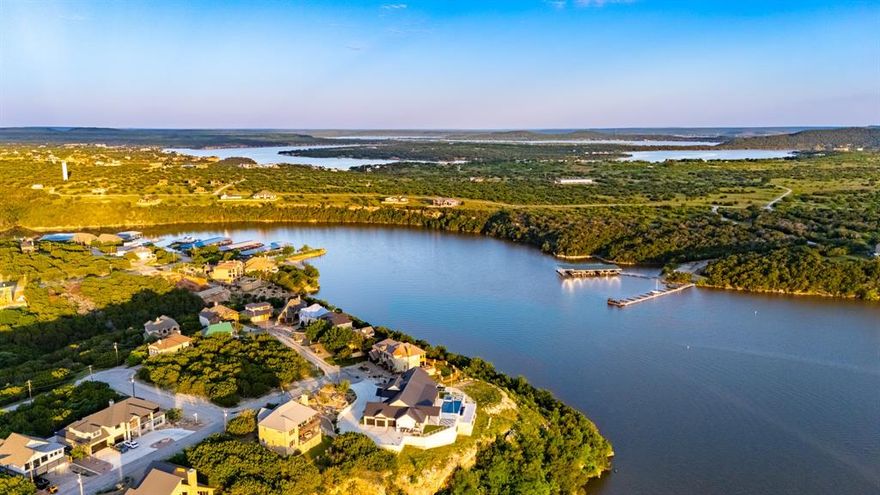 Opportunities like this are becoming fewer and fewer in this fabulous location! This beautiful lake view lot, located in The Cliffs Golf Community, boasts panoramic views of Possum Kingdom Lake from an elevated plateau and is surrounded by multi million dollar homes in the exclusive Oyster Bay neighborhood. Enjoy 36 free rounds of golf on the Cliffs Championship Golf Course overlooking the sparkling blue waters of Possum Kingdom Lake. Amenities of the Cliffs include two community pools, fitness center, spa, tennis-pickle ball courts and a lakefront beach at The Cliffs VIP Marina and don't forget fine dining at the Chapparel Bar & Grille!  Possum Kingdom Lake is the most beautiful lake in Texas with fishing, boating, the best 4th of July fireworks show you'll ever see, plus hiking trails that provide an incredible opportunity to make memories of a lifetime with your family and friends. This low maintenance homesite allows for less upkeep and more fun! Bring the builder of your choice and there's no time in which you have to build. Perfect homesite for a weekend get away or full time residence, one has a way to lead to the other from my experience!