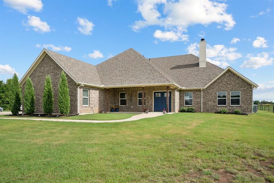 Set back from the road and framed by wide-open views, 2435 Cobler offers a blend of privacy, space, and convenience. The open-concept kitchen, dining, and living areas create a natural gathering space, complete with high ceilings, a brick fireplace, and generous natural light. The kitchen features white cabinetry, granite counters, a breakfast bar, and a 6-burner Thor range with griddle and dual ovens — a chef’s dream for both everyday cooking and entertaining.

The primary suite is a true retreat, with a spa-like bath that includes dual vanities, a soaking tub, and a walk-in shower. The oversized closet is also a tornado shelter, adding both function and peace of mind. Two additional bedrooms and a well-planned laundry area provide comfort and versatility.

Out back, a covered patio overlooks the in-ground pool and fenced pool area — ideal for summer days. A convenient outdoor-accessible bathroom makes poolside living even easier. The 12.6 acres stretch out for recreation, gardening, or simply enjoying the view. The 30' x 30' heated workshop offers space for projects, storage, or hobbies, while spray foam insulation and a whole-home back-up generator keep the home efficient and ready for any season.

Whether you envision hosting gatherings, raising animals, or simply soaking in the quiet, this property delivers the space and amenities to make it happen.