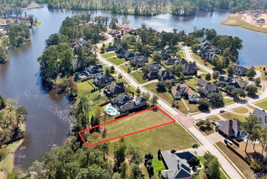 Discover the perfect canvas for your dream home with this exceptional lakefront lot in the prestigious Lakeside on Long Lake community in Shreveport. Located within a gated neighborhood with guard access, this lot combines the beauty of lakeside living with peace of mind. Enjoy serene lake views and easy access to a private boat ramp, ideal for non-motorized boats, allowing you to fully embrace waterfront relaxation and recreation. This grassed lot is ready to build and provides convenient access to city sewer and water. With the HOA covering maintenance of the neighborhood's common areas, you’ll have more time to enjoy the picturesque surroundings of Lakeside on Long Lake.