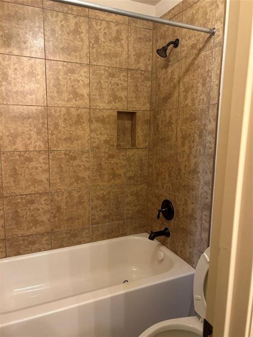 7312 Estela is a spacious single-family home located in the Mira Lagos East Phase B subdivision of Grand Prairie, Texas.Built in 2007, this two-story residence offers approximately 3,812 square feet of living space. Bedrooms and Bathrooms: The home features 5 bedrooms and 4 full bathrooms. The master suite, located on the first floor, includes dual sinks, a jetted tub, a separate shower, and walk-in closets.  
Living Areas: There are three living areas, including a wired media room and a study. The formal dining and living rooms boast hardwood flooring.  
Kitchen: The kitchen is equipped with granite countertops, a double oven, a breakfast bar, and an island  Additional Amenities: All bedrooms have ceiling fan 
Exterior Features:
Outdoor Living: The backyard offers an outdoor living area with a gas-start fireplace, perfect for entertaining.    
Location: The home is within walking distance to Joe Pool Lake, providing easy access to outdoor recreational activities.It is also situated in the Mansfield Independent School District, with nearby schools including Anna May Daulton Elementary School, Mary Lillard Intermediate School, and Mansfield Lake Ridge High School.