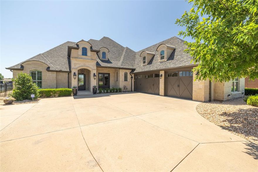 Discover this stunning French Contemporary home on nearly half an acre with 96 feet of lakefront in the coveted community of The Island on Lake Granbury! This exquisite property features an immaculate backyard pool, a private boat dock, and a spacious back porch perfect for enjoying southern breezes and evening shade. Designed for entertaining, the home boasts luxurious upgrades including elegant chandeliers, built-in storage, art niches, handscraped hardwood floors, marble tile, and custom finishes throughout. The Master Suite is a true retreat with a designer closet, dressing area, built-in dressers, an oversized jetted tub, and a shower with wall jets, rainhead, and handheld features. Enjoy breathtaking views of the lake and City of Granbury fireworks from your upstairs balcony. In the heart of historic Granbury close to shopping, restaurants, golf course, and entertainment. With too many upgrades to list, be sure to check the attachment in the documents for a complete overview!