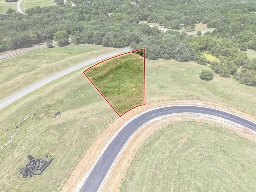 Discover the perfect blend of luxury and nature with this prime 0.62-acre lot in Rock Creek Resort, one of the larger homesites currently available. Nestled within a 1,300-acre master-planned, guard-gated community along the shores of Lake Texoma, this lot is mostly cleared with a few trees at the rear, providing an inviting setting for your future custom home. Rock Creek is designed for those who desire both recreation and relaxation, offering a golf membership with 6 rounds per month on the Jack Nicklaus-designed championship course. Additional amenities include a beautifully appointed clubhouse with dining, a pro shop, fitness center, resort-style pool, tennis, basketball and pickleball courts, driving range, and putting green. For outdoor enjoyment, residents have access to parks, miles of hiking and biking trails, and a private marina with fuel station for boating and fishing. With 24-7 security and no required timeline to build, Rock Creek is the ideal place to create your dream home and experience the unmatched lifestyle of Lake Texoma living.