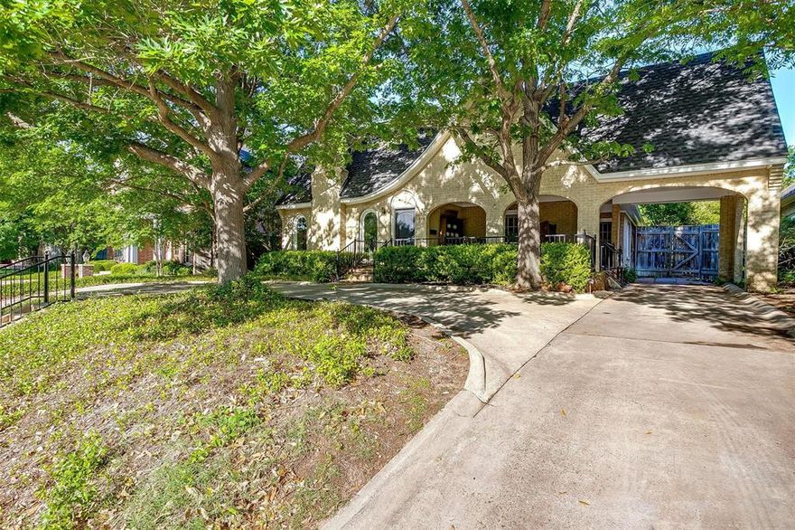 1920s character and charm abound in this Tudor-style home nestled in the Berkeley Place neighborhood of central Fort Worth. POOL RECENTLY REPLASTERED AND UPDATED. Visitors are welcomed by a decorative double chimney, brick archways, and inviting front porch. Upon entry, the living room quickly reminds its guests of this home's historic appeal with its vaulted barrel ceiling, picture rail molding, arched windows, and functional gas log fireplace with original tile surround. The sizable dining room with original light fixture is centered between the living room and kitchen. The expanded kitchen is equipped with a double oven, a center island with induction cooktop and prep space, period lighting, and a built-in desk. Kitchen is plumbed for natural gas if a gas cooktop is prefered. The bedrooms and bathrooms overflow with period fixtures and style. Original windows replaced with Anderson double pane windows. DON’T MISS A PEEK INTO THE HUGE ATTIC! Because of the steep roofline, there is a strong possibility for additional square feet through an attic conversion. Something to certainly consider! 
A step into this backyard is a journey away from the hustle and noise of the city. This secluded outdoor space surrounded by large trees and tall shrubs includes an inground pool, a patio, and a lawn ready for your next gathering with friends or simply a quiet morning with coffee. 
Known for its historic charm and filled with homes of various architectural styles, Berkeley Place is a close community with regular social events for adults and fun activities for kids. Zoned for some of Fort Worth’s best public schools…Lily B Clayton Elementary, McLean Middle School, and Paschal High School. An easy walk to the Fort Worth Zoo, Forest Park Pool, Trinity Trails, and Westbend riverfront shopping and dining. Don’t miss the chance to make a home at 1929 Forest Park Blvd in Berkeley Place, Fort Worth!