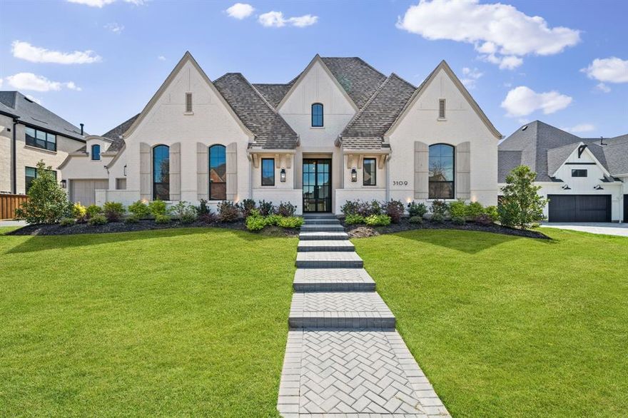 Located in the sought after community of Mustang Lakes and zoned to Prosper ISD, this exceptional Huntington Homes residence was completed in 2024 and thoughtfully enhanced with more than $200,000 in upgrades. Situated on an oversized .46 acre lot with pond and greenbelt views, the home offers 5,084 SF of beautifully designed living space with a floor plan that flows effortlessly from room to room. Hardwood flooring, designer lighting, custom cabinetry, and elevated architectural details create a refined yet comfortable atmosphere throughout. The main living areas are designed for gathering, anchored by a spacious living room with a cast stone fireplace and expansive windows that fill the home with natural light. The chef’s kitchen is both striking and functional, featuring Taj Mahal quartzite countertops, a large island, Wolf and SubZero appliances, an upgraded kitchen hood, and an expanded walk-in pantry designed for exceptional storage and everyday convenience. Situated on the first floor, the primary suite is complemented by a spa-like bath and custom California Closet system, with three additional downstairs bedrooms, a private office, and media room rounding out the main level. Upstairs, a spacious game room creates an additional gathering space along with a private upstairs bedroom that is well suited for family or guests. The covered patio extends the living space outdoors and is pre-plumbed for your future grill and appliances, while the oversized backyard offers ample room to design a custom pool. Completing the home is an oversized four car garage with additional golf cart or workshop space, epoxy flooring, and generous storage throughout. Ideally located just minutes from the North Dallas Tollway, Highway 380, and the Collin County Outer Loop, this home offers seamless connectivity across North Dallas while maintaining the peaceful setting that makes Mustang Lakes one of the area’s most desirable communities.
