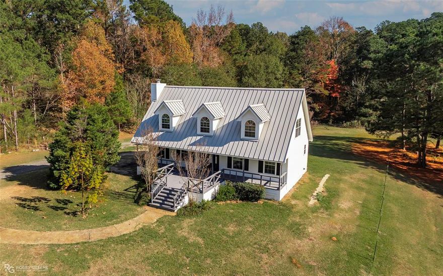 Beautifully updated LAKEFRONT home on 2.5 acres with direct access to Black Bayou! Exterior has been completely repainted, including a freshly painted front deck. Inside, enjoy new carpet, mostly new lighting, and fresh interior paint in select areas. This home offers 3 bedrooms, 2.5 bathrooms, and fantastic outdoor features including a large extended covered patio, RV storage with an attached workshop, and a 2-stall boat dock with a spacious gear closet perfect for storing life jackets, fishing gear, and lake essentials. To the left of the home, all you see is woods....nice and private. A rare opportunity for peaceful waterfront living!