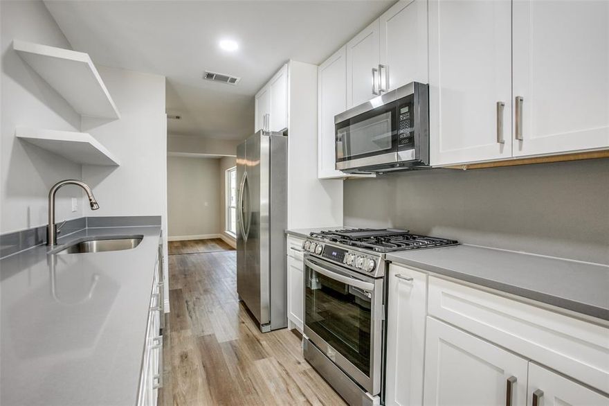 Welcome Home to this cute fully renovated 4 bedroom, 2 bath house. This beautifully updated home features a fully remodeled kitchen with QUARTZ counter tops, QUARTZ backsplash, BRAND NEW stainless steel appliances soft close wood cabinets and luxury vinyl flooring throughout the home.  Continue into the family room that features a cozy wood burning fireplace for those cooler nights; updated windows and doors provides a lot of natural light; The luxury flooring continues into the hall where you come to the three secondary bedrooms and guest bathroom which included luxury tile in the shower; As you move to the primary bedroom you will see the primary bath has a marble countertop, luxury tile in the shower with marble floor. All the windows have been replaced with more energy efficient thermal windows. This is a must see!