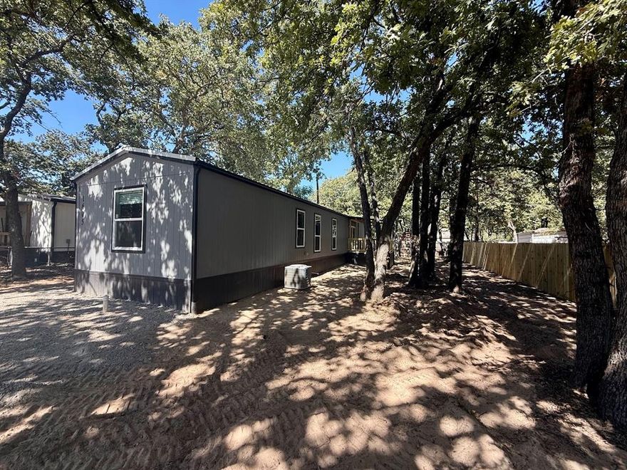 Come and Enjoy the Lake and live in a New 2025 Champion Home with two decks. Split bedrooms, luxury vinyl floors
throughout the home and large pantry, refrigerator included! Home is surrounded by mature oak trees on a quite secluded cul-de-sac. Community has a public boat dock where residents can launch for free and a free public beach and park. More Pictures Coming Soon!