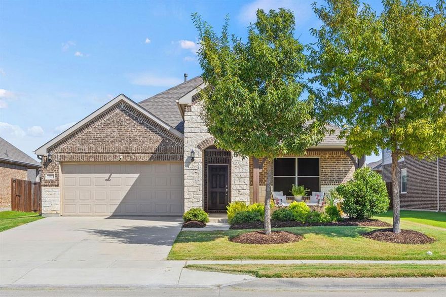 Inviting and spacious single story home seeks new owners! This elegant & efficient floorplan highlights an open living space complemented by peaceful & private bedrooms. At the heart of the home, the kitchen impresses with soaring ceilings, large island, gas range, granite countertops, & abundant storage. A built-in desk area adds a thoughtful touch—great for home office, study station, or organizational hub. Kitchen flows seamlessly into breakfast nook and living room with fireplace. Private primary suite features walk-in tandem shower, dual vanities, & seriously sizable his-and-hers walk-in closets. Outdoors, take your pick of charming covered porches, front or back (upgraded brick) for your morning coffee or relaxing after work. Located in the desirable Willow Ridge community, enjoy access to a neighborhood pool, playgrounds, and sports fields near schools within walking distance. You will love the proximity to shopping, dining, & entertainment. Short drive to Hwy 287, Fort Worth, airports, and AT&T Stadium and Globe Life park. Ask about seller-offered credits for new flooring updates, AND lender-paid 1-year temporary rate buydown available, lowering a borrower’s interest rate by 1% for the first 12 months (subject to program terms and buyer qualification).