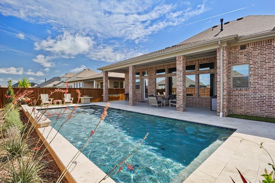 With an acceptable offer seller will contribute up to $5,000 towards buyers closing costs. Nestled in a picturesque neighborhood near top-rated schools, charming downtown, and scenic Lake Ray Hubbard, this like-new, modern-style home offers an exceptional lifestyle in one level. A thoughtfully designed open floor plan unfolds as you enter—leading from an inviting covered porch into a stunning living area featuring designer lighting, a raised-panel feature wall, and a cozy fireplace. The seamless flow continues into the heart of the home: a chef-inspired kitchen boasting quartz countertops, custom cabinetry, a center island with breakfast bar, and high-end appliances. Adjacent to the kitchen, the formal dining room sets the stage for memorable family gatherings. A spacious media-game room—also perfect for a second living space—offers versatility and is ideal for everyday relaxation or entertaining guests. The generous owner’s suite overlooks the sparkling pool, opening directly into a spa-style bath with luxurious finishes. Three additional bedrooms feature roomy closets and share easy access to meticulously finished bathrooms. A private home office provides the perfect work-from-home environment. Plus, an expansive mudroom with built-ins adjoins the laundry area and garage—organized living at its best. Step outside to an extended covered patio that overlooks a sparkling pool and spa—perfect for outdoor entertaining or quiet afternoons. The lush, fully fenced backyard offers both privacy and appeal. Every detail of this home has been thoughtfully curated—from the designer fixtures to the desirable floor plan and tranquil outdoor oasis. This truly is a must-see home for discerning buyers seeking modern comfort and exceptional lifestyle amenities.