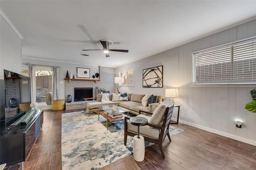 Classic Mid Century Modern charm on nearly half an acre, this timeless home is nestled on a rolling, tree studded lot that spans .44 acres and offers a setting that is truly special. Recently refreshed with new exterior paint, it presents striking curb appeal and an air of sophistication from the moment you arrive. The entry showcases the original double front doors that were custom to the home and set the tone for the character and craftsmanship found throughout. Inside, generous living spaces invite both relaxation and entertaining, with expansive windows that pour natural light into the home and create a seamless connection to the serene outdoor surroundings. The kitchen has been beautifully updated with new countertops and a stylish backsplash, blending mid century character with modern function. The home includes a spacious room on the main level that provides exceptional flexibility to be used as a bedroom, an informal den, a private office, or a dedicated kid’s area. Upstairs, three well sized bedrooms share a thoughtfully appointed bathroom with a large walk in shower, making this level an inviting retreat for family or guests. The layout gives the next owner the freedom to shape the home around their lifestyle, which is part of what makes the property so unique. Original architectural details remain intact and pay homage to the home’s era, while thoughtful updates ensure comfort and ease for everyday living. Properties with this level of character, privacy, and land rarely come to market, especially on one of the most desirable streets in the neighborhood. This home offers a sense of history, beauty, and opportunity that is not often found, creating an experience that is truly fortunate for the next owner.