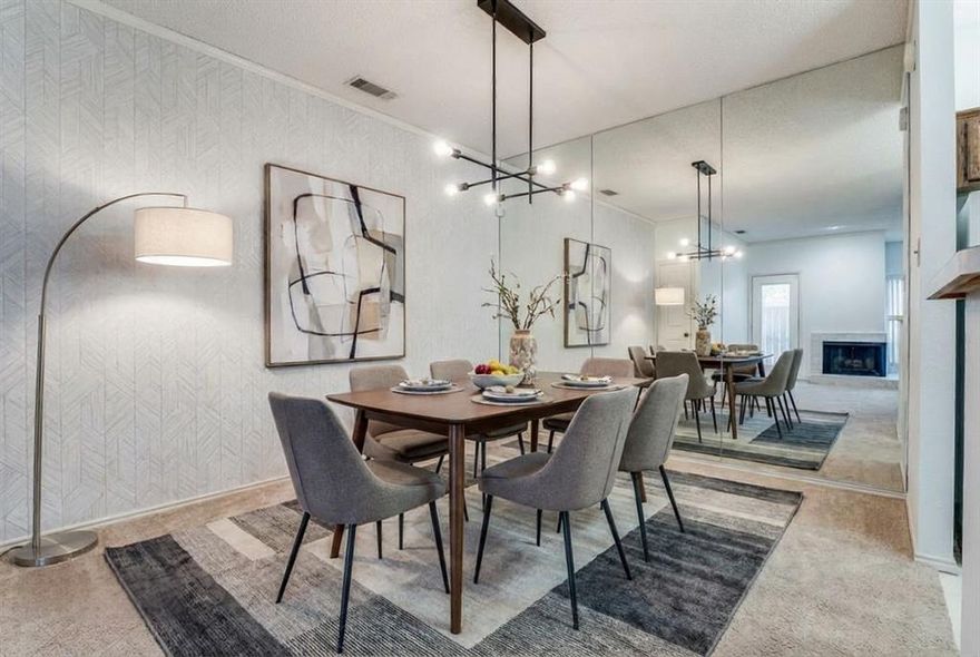 Charming first floor two bedroom & one bath condominium in North Arlington near the entertainment district including AT & T Stadium, Globe Life Field, Six Flags Over Texas & Hurricane Harbor. Featuring an open concept layout, the living room flows into the dining room, perfect for entertaining. The living room includes a tiled floor area, perfect for a study and a cozy two sided wood burning fireplace. A covered patio is located off of the main living area, perfect for enjoying outside dining. The galley kitchen offers all the amenities & includes the utility for convenience. Two spacious bedrooms both feature walk-in closets. The primary bedroom also enjoys a second patio for relaxing & unwinding. A hall bathroom offers two separate vanities and a spacious glass enclosed shower. During the summer, residents can relax and enjoy the community pool. This condominium is perfect for first time homebuyers, downsizing or for owners who desire a low maintenance lifestyle in a prime location near shopping, the DFW Airport, & entertainment venues.