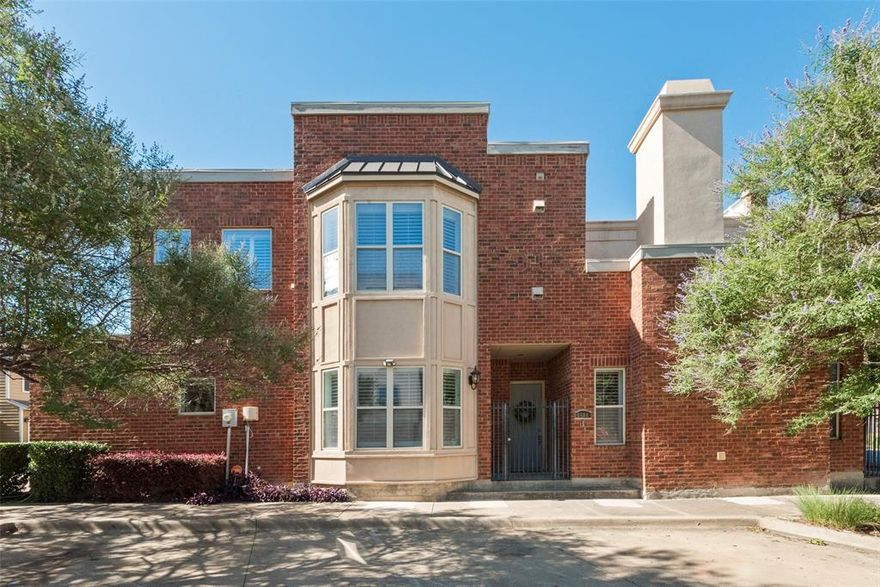 Welcome to this beautifully updated corner-unit townhome in the heart of historic downtown Plano. Featuring 3 bedrooms and 3 full baths, this home perfectly combines modern upgrades with charm and walkable convenience. Recent updates include all-new flooring with high-end luxury vinyl plank, plush new carpet upstairs, and freshly painted interiors. The spacious living room offers soaring ceilings, a cozy fireplace, and custom built-ins, while plantation shutters fill the space with a high end feel. The open-concept kitchen shines with granite countertops, modern painted cabinets,  and abundant storage, flowing seamlessly into the dining area, ideal for entertaining. A main level bedroom with full bath provides flexibility for guests, an office, or private study. Upstairs, the primary suite is a true retreat with its own fireplace, spa like ensuite bath, and walk-in closet. An additional upstairs bedroom also features a private ensuite bath, ensuring privacy for all. Enjoy the outdoors in your private gated patio, perfect for morning coffee or evening relaxation. As a corner unit, the home offers extra light, privacy, and thoughtful storage solutions. Just minutes from US-75, commuting to Dallas is a breeze. Step outside and enjoy downtown Plano’s vibrant shops, restaurants, parks, and Farmers Market, all within walking distance. Ample guest parking and nearby DART access make this location second to none.