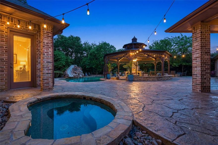CUSTOM POOL HOME in highly acclaimed Lovejoy Independent School District situated on over 1 acre! This extraordinary residence showcases a luxurious finish-out with impeccable attention to detail, featuring rich hardwood floors, three fireplaces, and a bright, gourmet kitchen designed for both everyday living and entertaining. The ideal floorplan offers 4 spacious bedrooms on the main level, including a private primary retreat with a spa-like bath, along with a handsome study complete with well-crafted built-ins. Upstairs, you’ll find a versatile game room, additional living area, and a 5th bedroom—perfect for guests or multigenerational living. A 4-car garage and abundant additional parking provide plenty of space for vehicles, hobbies, and storage. Step outside to your own private entertainer’s paradise. The expansive backyard is designed for unforgettable gatherings, featuring a sparkling pool and spa, gazebo, outdoor kitchen, wood-fired pizza oven, and firepit—all surrounded by mature landscaping for exceptional privacy. A rare opportunity to own a beautifully designed home with space, luxury, and functionality in one of the area’s most sought-after school districts.